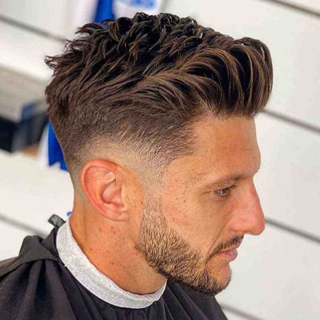 Texured quiff with low taper fade hairstyle 
