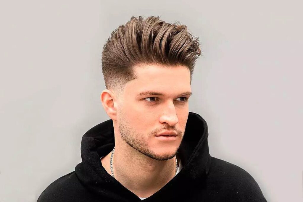 Classic taper fade with defined curls hairstyle 